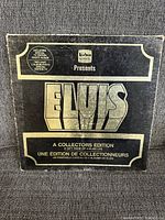 Front cover of Elvis A Collectors Edition vinyl box with black and gold contrast, showing brand and edition information.