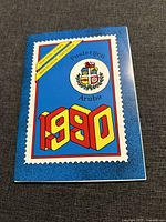 Blue cover of the display album for the Aruba postage stamp collection, dated 1990, featuring crest and decorative text and border.