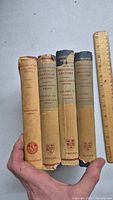 Five vintage medical books, four volumes of Cunningham's Manual of Practical Anatomy and one additional medical book on Diseases of Nose, Throat and Ear.