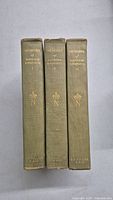Spine view of the three hardcover books titled 'Memoirs of Napoleon Bonaparte' with gold gilt text and crown emblem on each spine.
