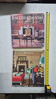Two large hardcover books on English interior design displayed with a measuring tape showing length of about 12 inches.