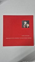 Front cover of the red hardcover art book titled 'Portraits of Canadian Women Who Inspire' by Gerda Neubacher, showing title and small artwork image
