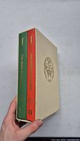 Side view of two hardcover books in beige slipcase with emblem. Books titled 'The Irish In Canada' with volumes I and II on spines.