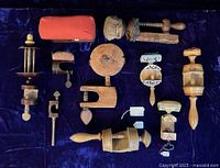 Overhead view of all ten wooden clamps and yarn winder laid out