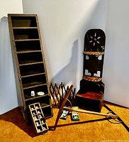 Three wooden display/storage units including spool holders, a thimble display, as well as collectible thimbles, a swift yarn winder, and a niddy noddy.