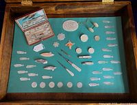 Wooden vitrine tray with mother-of-pearl necessaire (closed lid removed) and scattered small accessories