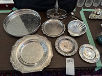 Group photo of all silver plate trays and dishes showing size and pattern variety