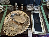 Overview of metal trays and salt and pepper shakers on table