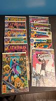 Full lot overview with Catwoman and Superman comic books arranged in two columns