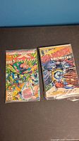 Dark Horse Danger Unlimited comic book series issues 1 and 2 shown in protective sleeves on a flat surface.