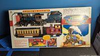 Original boxed vintage New Bright electric train set showing contents inside box window.
