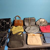 Photo of 10 assorted purses and bags showing variety of styles and materials