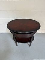 Top and front view of the oval bunk table showing finish and overall condition