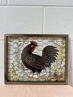 Full front view of framed farmhouse style picture with chicken wire overlay and rooster image.