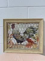 Front view of framed farmhouse rooster picture showing detailed rooster illustration with autumn leaves background.