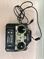 Full view of Futaba InterLink Elite USB controller with attached USB cable, placed on a light surface.