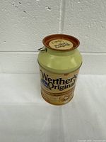 Front view of Werther's Original 2009 metal tin can showing brand label and candy graphics.