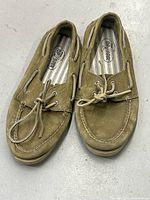 Pair of tan leather Sperry Top-Sider boat shoes, size 10M, showing front and top view with laces tied.