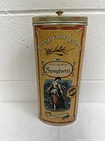 Front view of vintage Italia Luce DeCielo spaghetti tin can showing decorative label with woman illustration, text, and metal lid with knob.