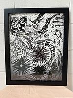 Full view of the framed abstract wall art showing the entire artwork and frame.