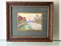 Framed miniature watercolour painting displayed against a wall showing the full artwork and frame for scale and condition.