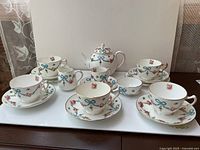 Full front view of entire tea set displayed together