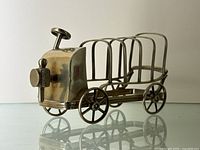 Angled side view showing the car design and six wire slots