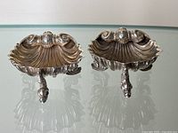 Front view of both shell-shaped salt cellars
