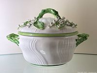 Front view of entire tureen with lid showing overall shape and decoration