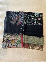 All four scarves folded and laid out together
