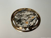 Overhead front view showing entire brooch and stone pattern