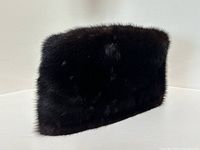 Side view of the men’s mink fur hat showing texture and shine of the dark brown fur.