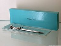 Pen displayed with Tiffany & Co. box and suede pouch