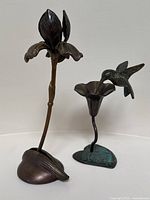 Group shot of both bronze candleholders