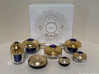 Full set of 8 Guerlain Orchide Impriale skincare products displayed in front of the decorative white box with gold design.