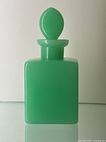 Front view of green opaline bottle with stopper in place
