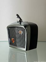 Front angled view of lighter showing grille design and hood ornament