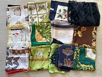 Twelve folded scarves arranged in grid, showing variety of prints and colors