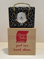 Vintage Phinney Walker jewel box travel alarm clock on original box, showing overall size and packaging.