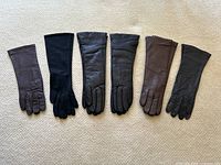 All six pairs of gloves laid out in order