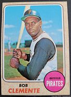 Front of 1968 Topps baseball card No. 150 featuring Roberto "Bob" Clemente, showing Clemente in batting stance with pink circle stating Outfield Pirates and his name printed at bottom.