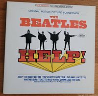 Front cover of The Beatles "Help!" vinyl album sleeve showing original motion picture soundtrack with title and song names.