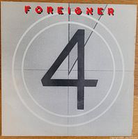 Front cover of Foreigner 1981 vinyl album "4" showing the large number 4 with the band name in red.