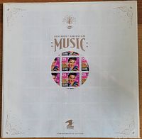 Full unopened sheet of 40 colorful Elvis Presley 29 cent stamps enclosed in original packaging showing gold decorative elements and Legends of American Music branding.