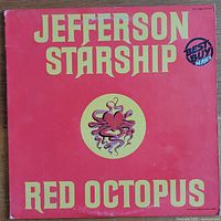 Front cover of the album Red Octopus by Jefferson Starship, showing the title, band name, and central octopus heart graphic on a red background.