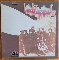 Front cover of Led Zeppelin II LP album showing the band in a sepia-toned photograph with title.
