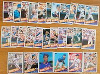 Photo showing 28 1985 Topps baseball cards arranged in rows, all featuring New York Mets players including star players such as Darryl Strawberry, Keith Hernandez, Dwight Gooden, Ron Darling, and Ray Knight.