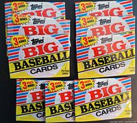 Nine unopened packs of 1988 Topps Big Baseball Cards, third series, arranged in rows exposing front package design.