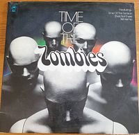 Front cover of the 1973 album "Time of The Zombies" by The Zombies, showing stylized heads and white text.