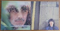 Front covers of two George Harrison vinyl albums: 1979 album with close-up portrait and 1981 'Somewhere in England' album with Harrison standing by a street wall.